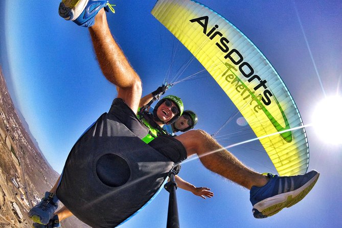 BRONZE tandem paragliding flight in South Tenerife, free pick up - Getting ready with a harness, helmet, and camera