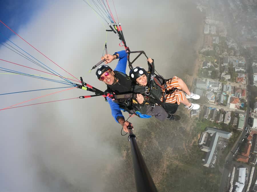 Cape Town: Tandem Paragliding Flight with the Experts - Landing near the ocean and returning uphill