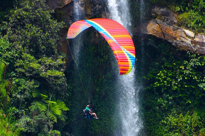 Fun RAFTING + Awesome PARAGLIDING over giant waterfalls from MEDELLIN - Taking on 2.5 hours of Class IV rafting