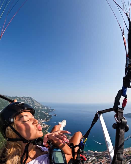 Paragliding in Budva with Certified Pilot (All-Inclusive) - Pickup, storage, and the beach finish